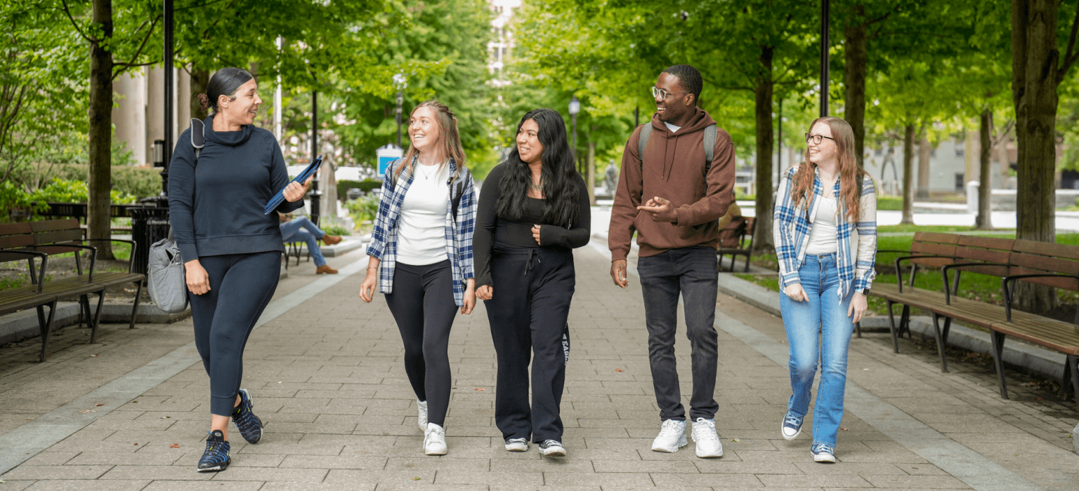 Students walking through Hancock Adams Common