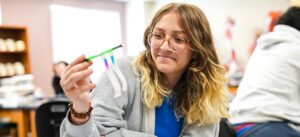High school student performing a science experiment