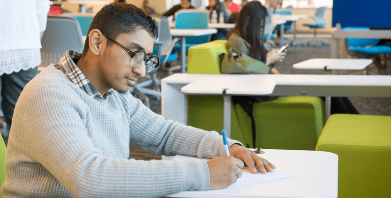 Quincy College Student in Anselmo Library