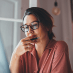 woman staring into a computer screen