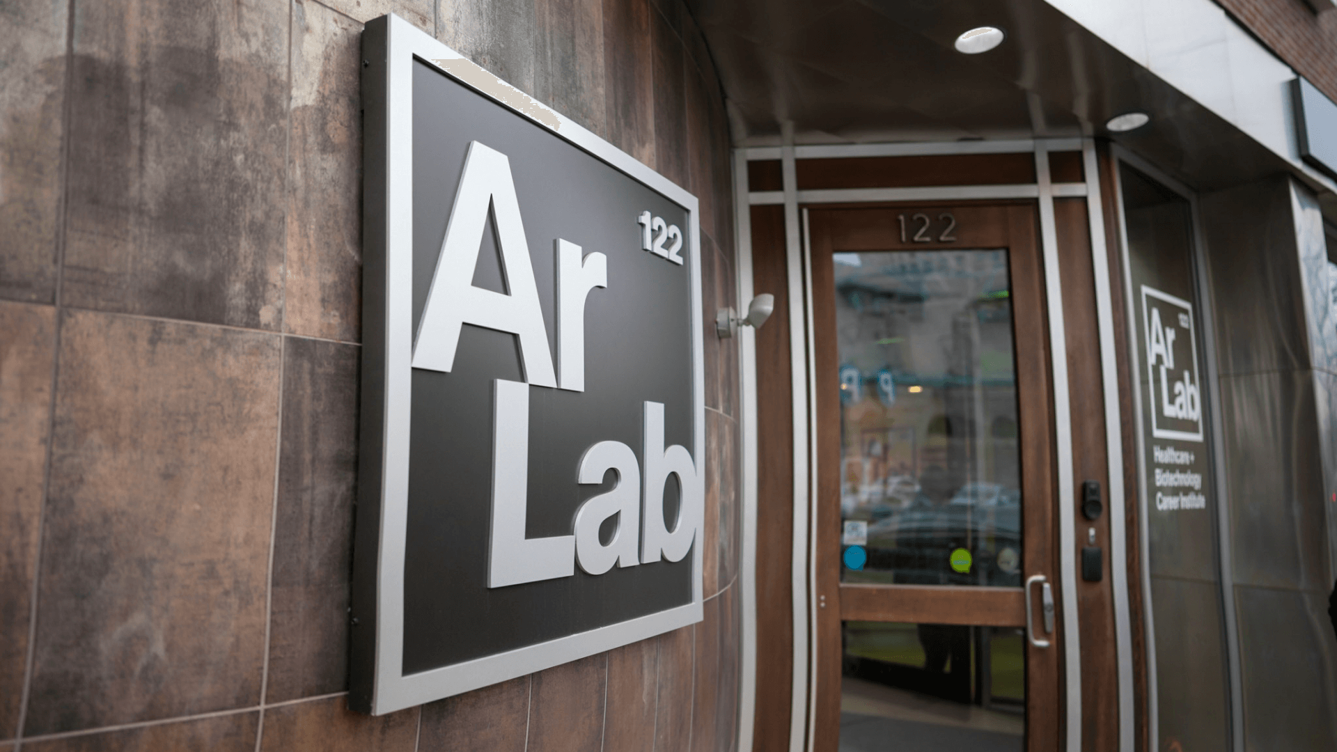 Outdoor building sign Quincy College ArLab in Boston